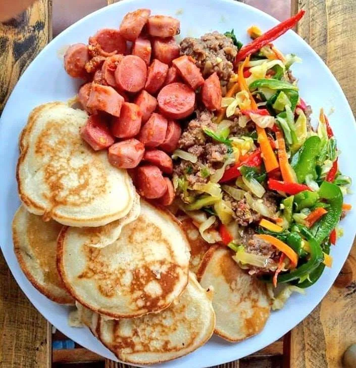 Mini pancakes, sausages, meatballs and colourful vegetables from Pancake Hub’s kitchen